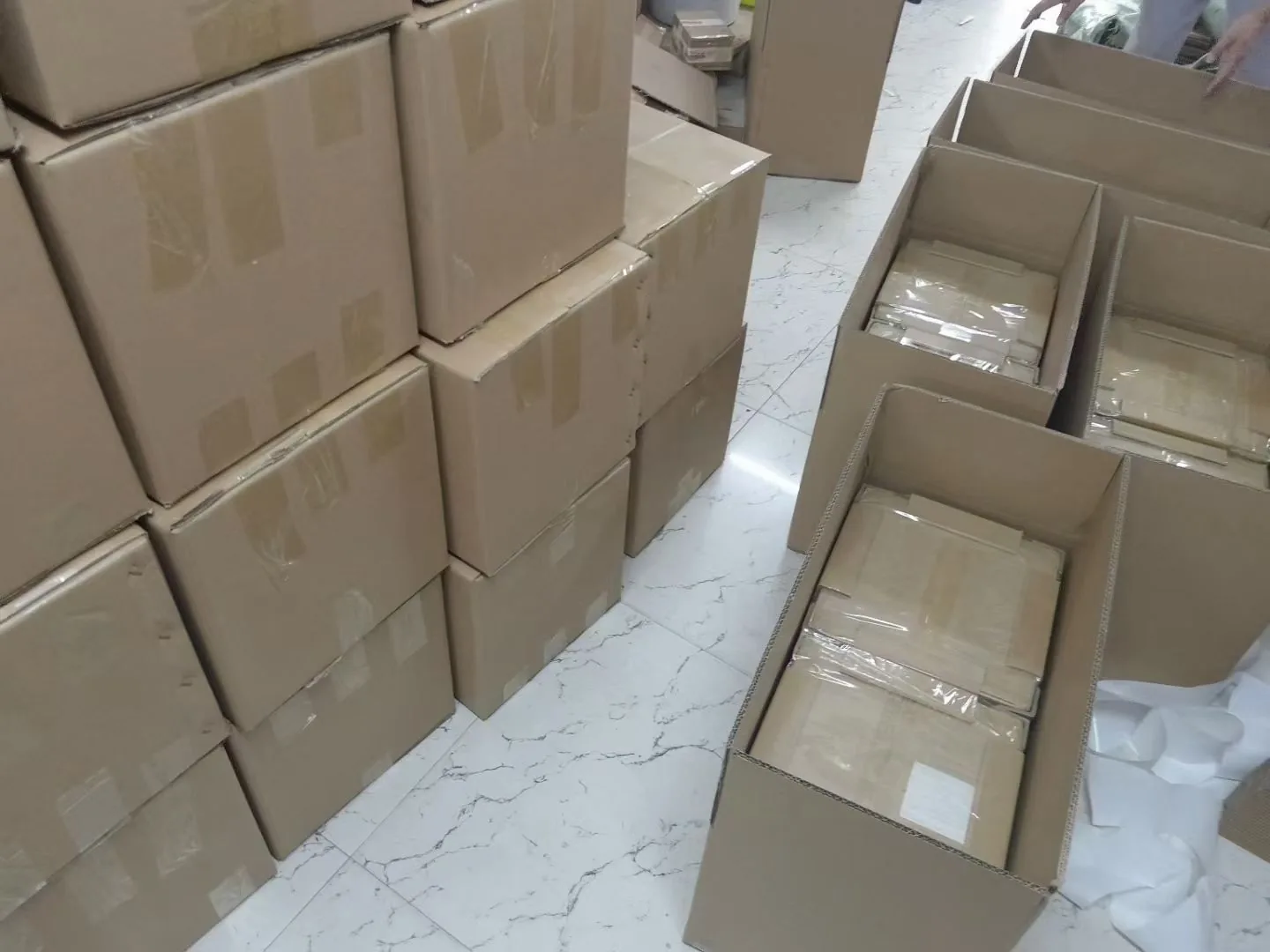 Cartons being prepared and packed before shipment